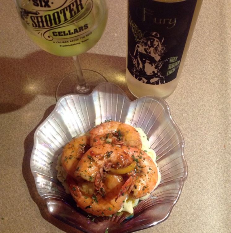 BBQ_d fresh Gulf shrimp over creamy garlic mash potatoes