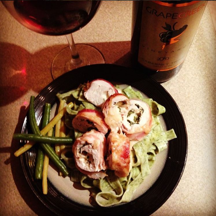 Rolled chicken breast stuffed with mozzarella basil and garlic